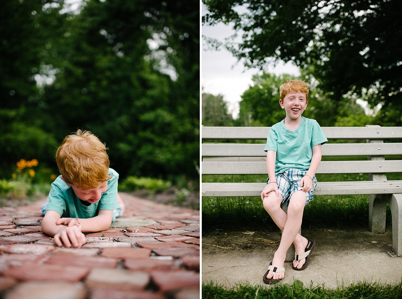 redhead boy sitting on park bench 