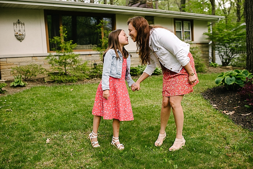 mom and daughter walking holding hands