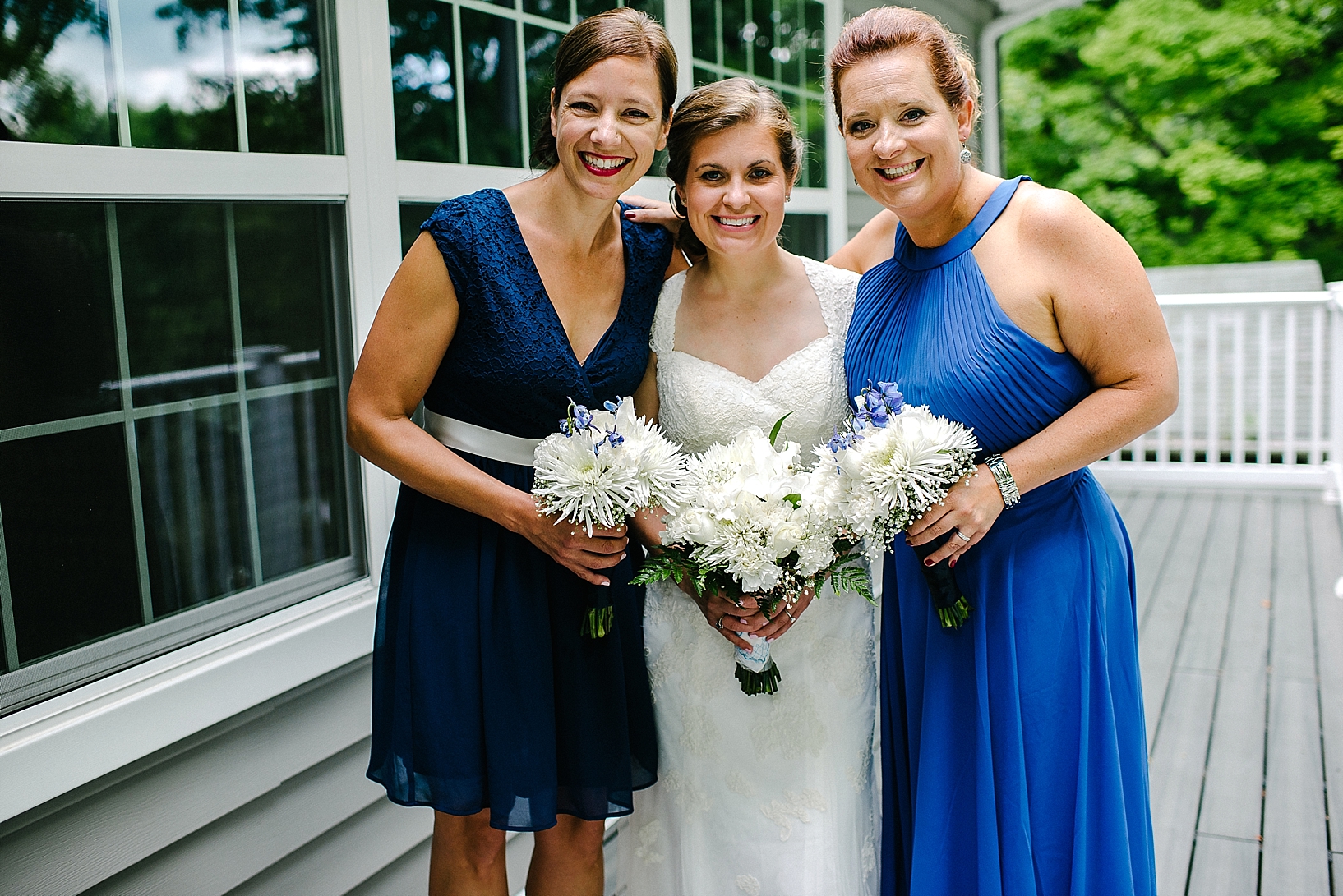 bride with bridesmaids in blue dresses