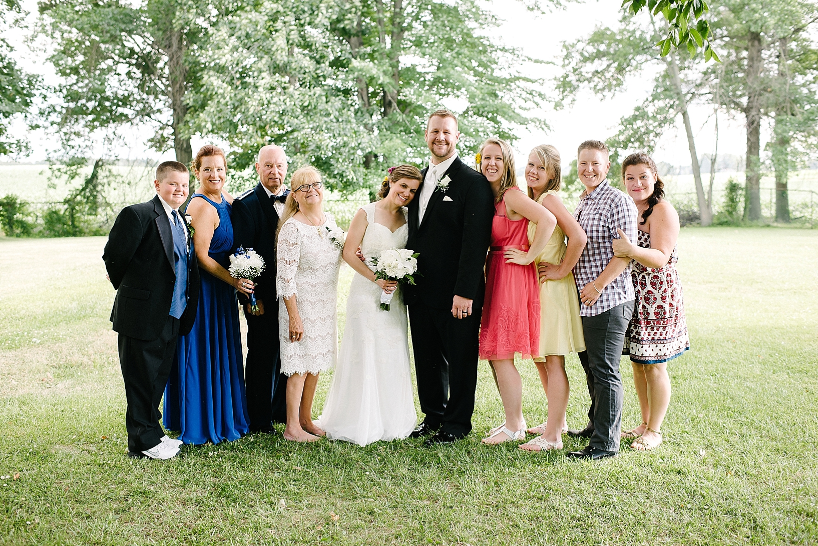 casual family with bride and groom