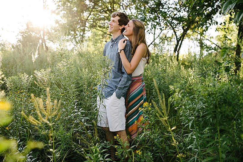 couple standing in field at Cox Arboretum