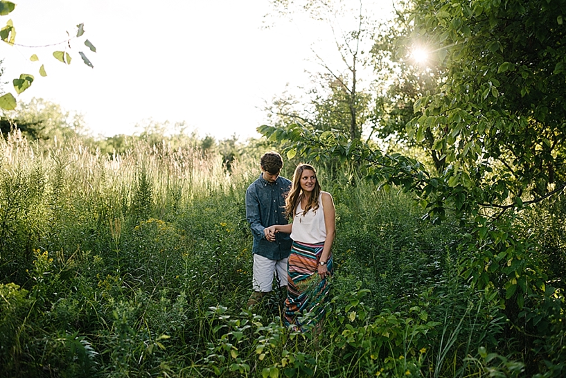 couple standing in field at Cox Arboretum