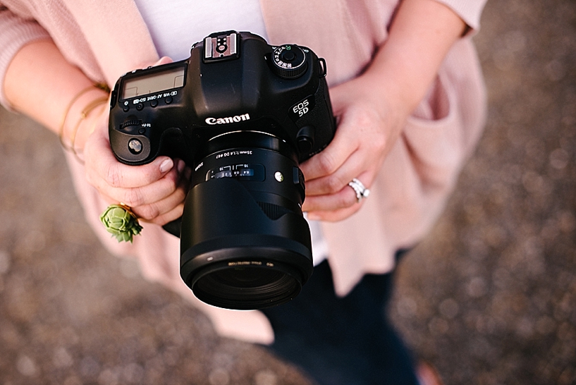 woman holding a Canon 5D Mark