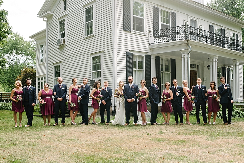 bridal party on lawn by Poland Town Hall