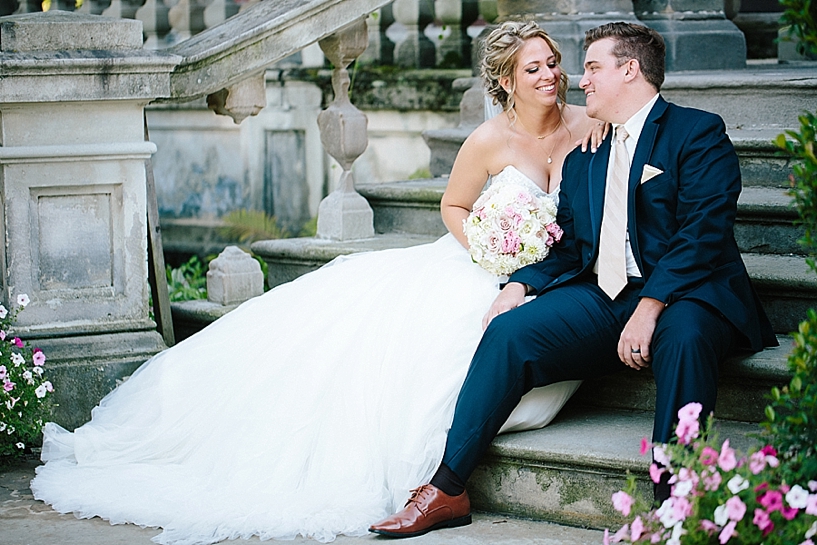 bride and groom sitting on steps of City Hall in Warren Oh