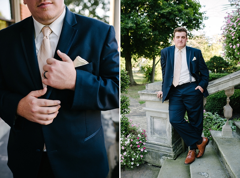 groom in navy suit and brown shoes