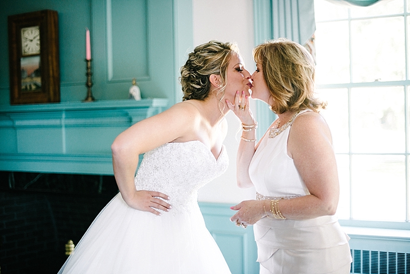 bride kissing her mother