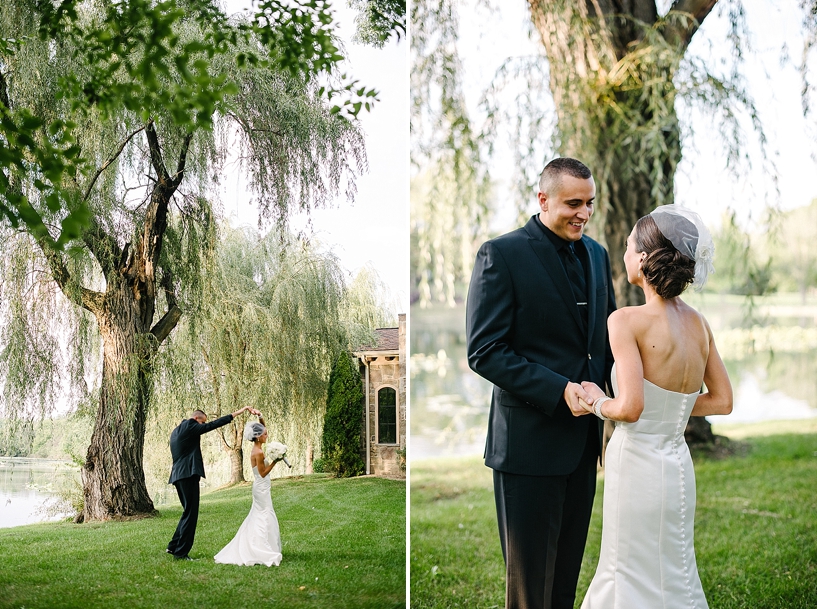 groom twirls bride underneath willow tree