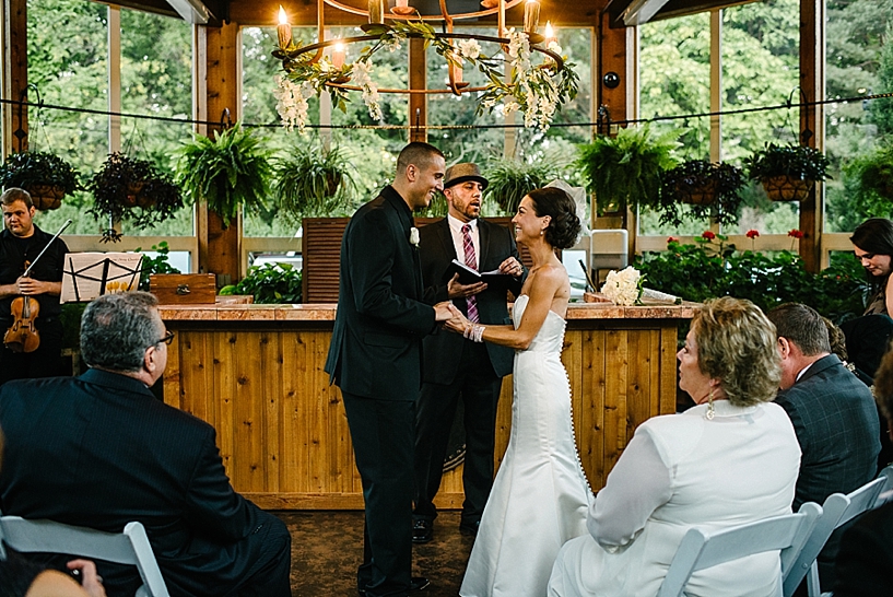 bride and groom exchange vows at Gervasi Vineyard Conservatory