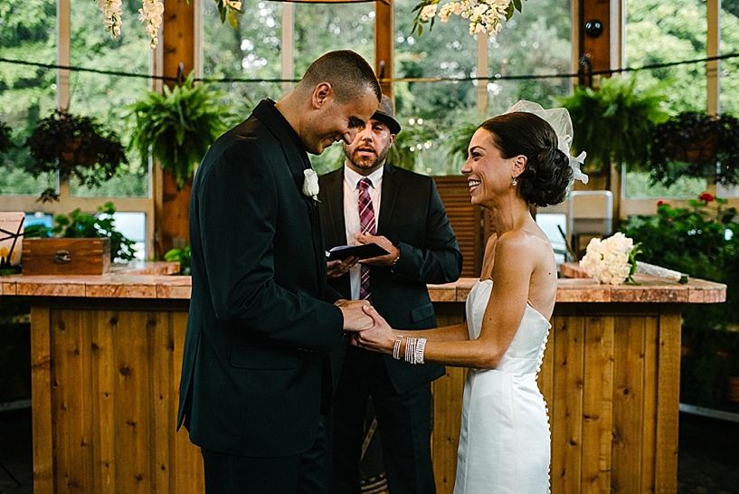 bride and groom exchange vows during ceremony at Gervasi Vineyard Conservatory