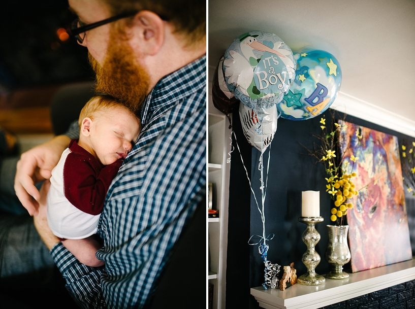 balloons on mantle fireplace and father holding newborn son