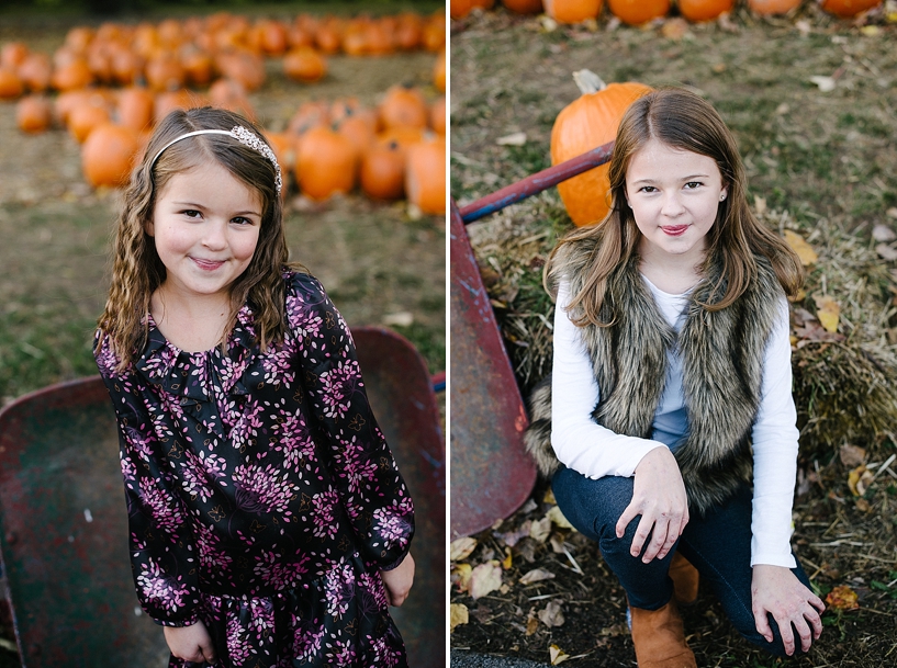 young girls standing in pumpkin patch 