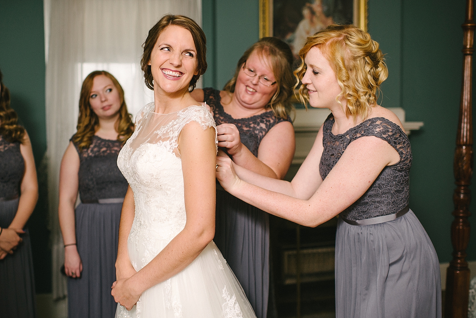 bridesmaids in gray lace gowns button bride's dress