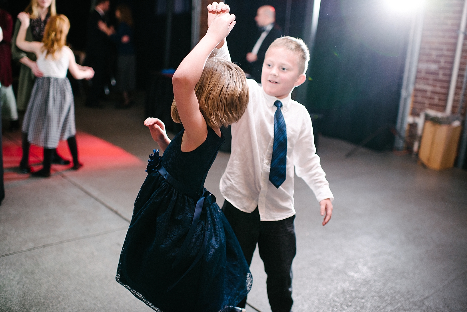 little boy and girl dancing at wedding