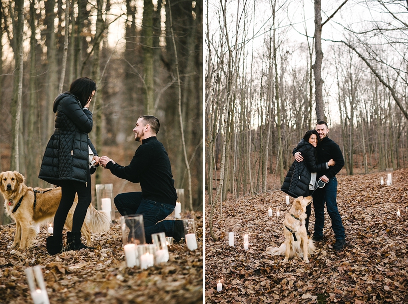 man proposing to woman in middle of woods with candles all around