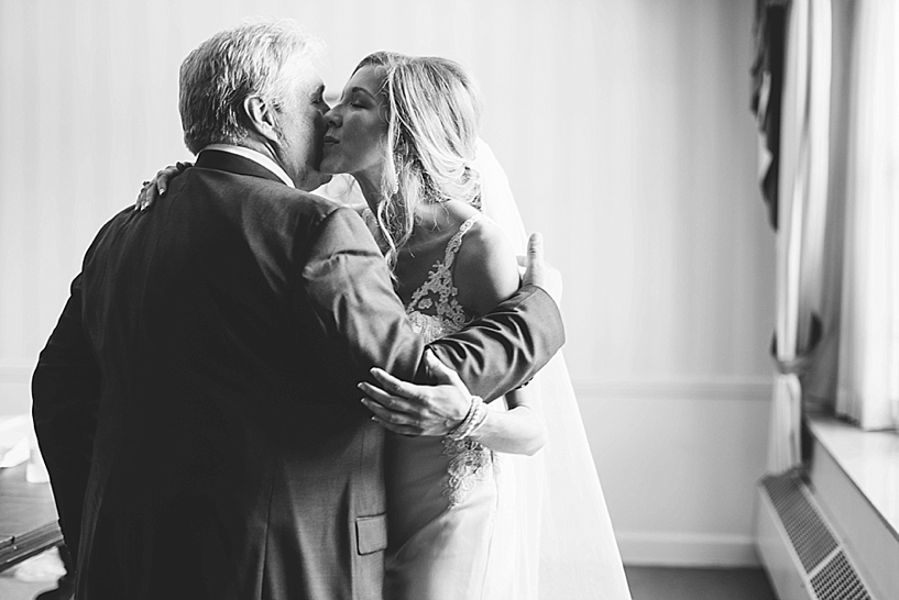 bride kisses her father on the cheek when he sees her for first time