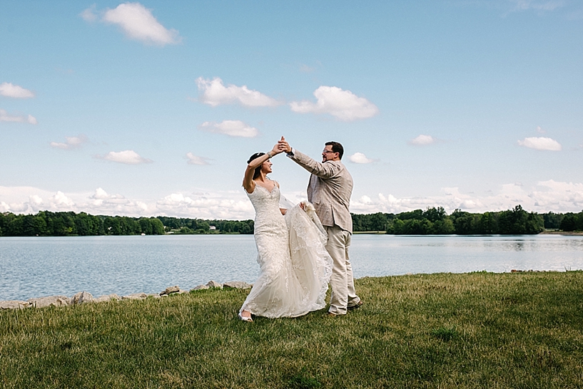 bride and groom dancing by lake Vineyards at Pine Lake wedding