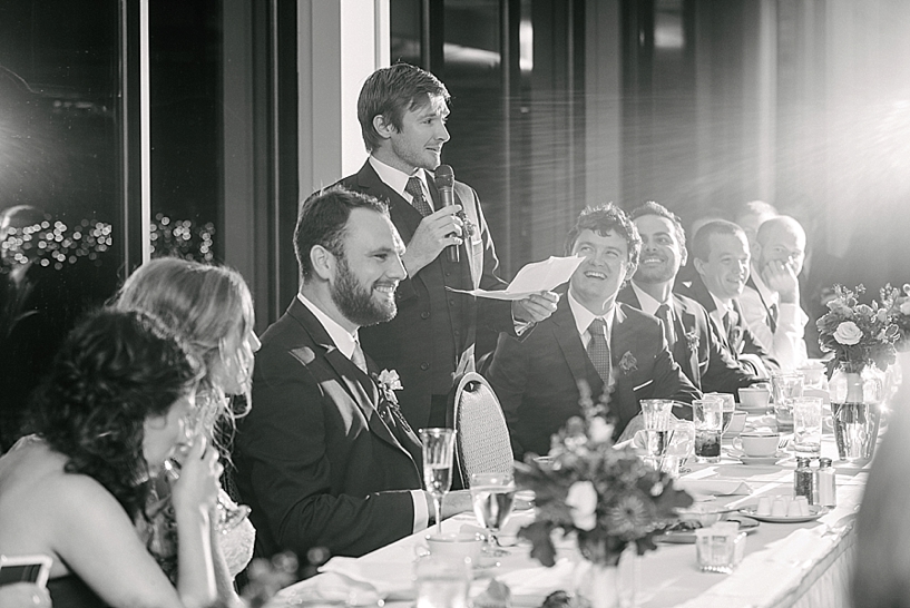 groomsmen gives toast during wedding reception