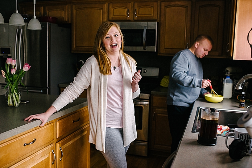 couple standing in kitchen making breakfast together