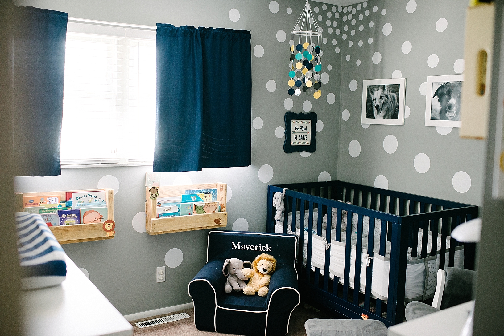 navy white and grey nursery with polka dots on walls