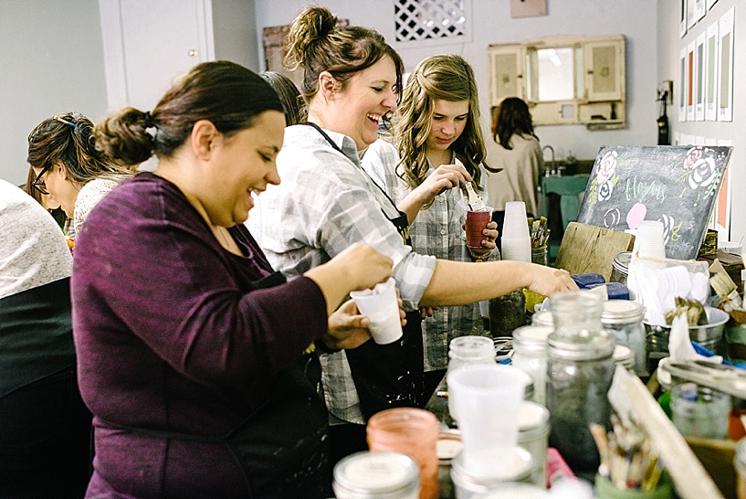 women laughing and mixing milk paint