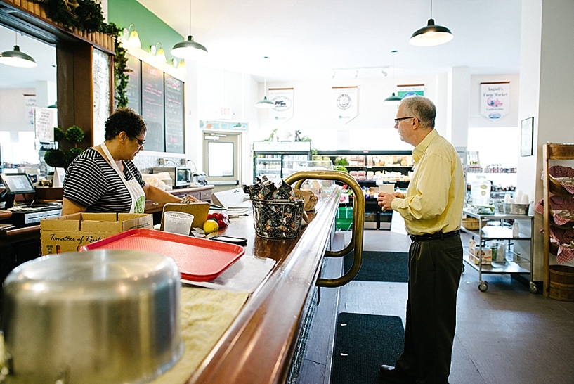 man placing order at counter of Cultivate Co-op cafe