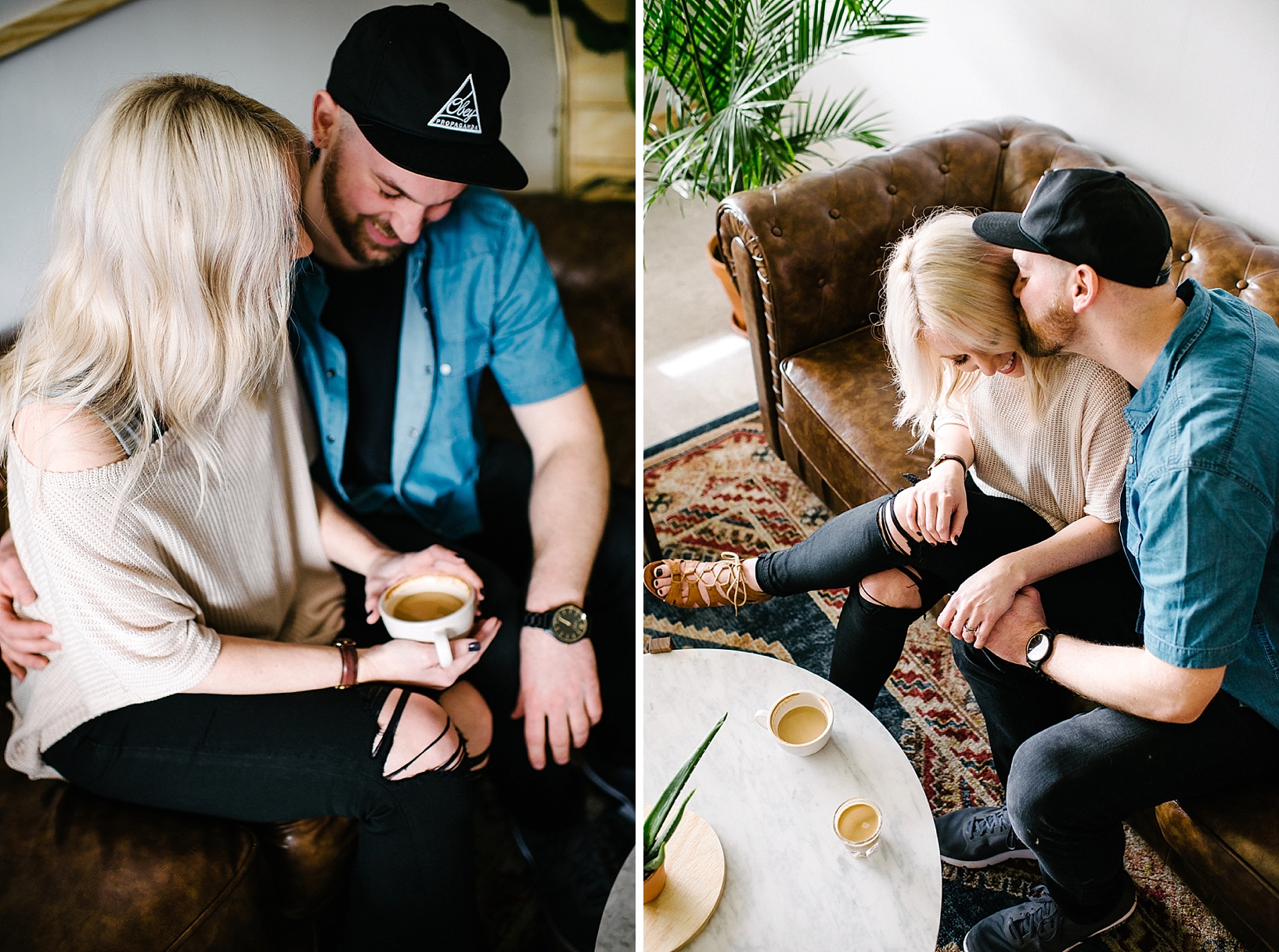 man in denim shirt and baseball hat kissing woman with blonde hair on the cheek sitting on couch drinking coffee