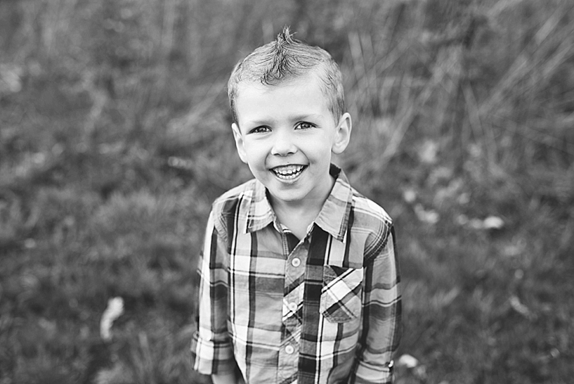 young boy with spiked hair wearing plaid shirt 