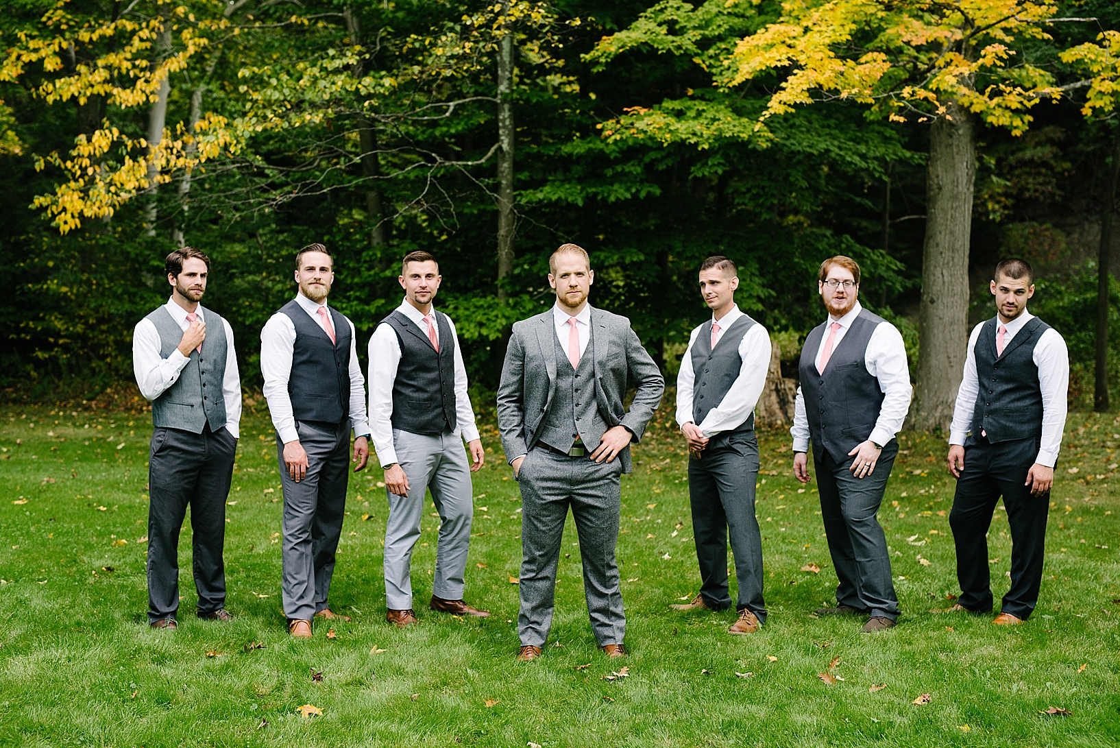 groom and groomsmen wearing grey suits
