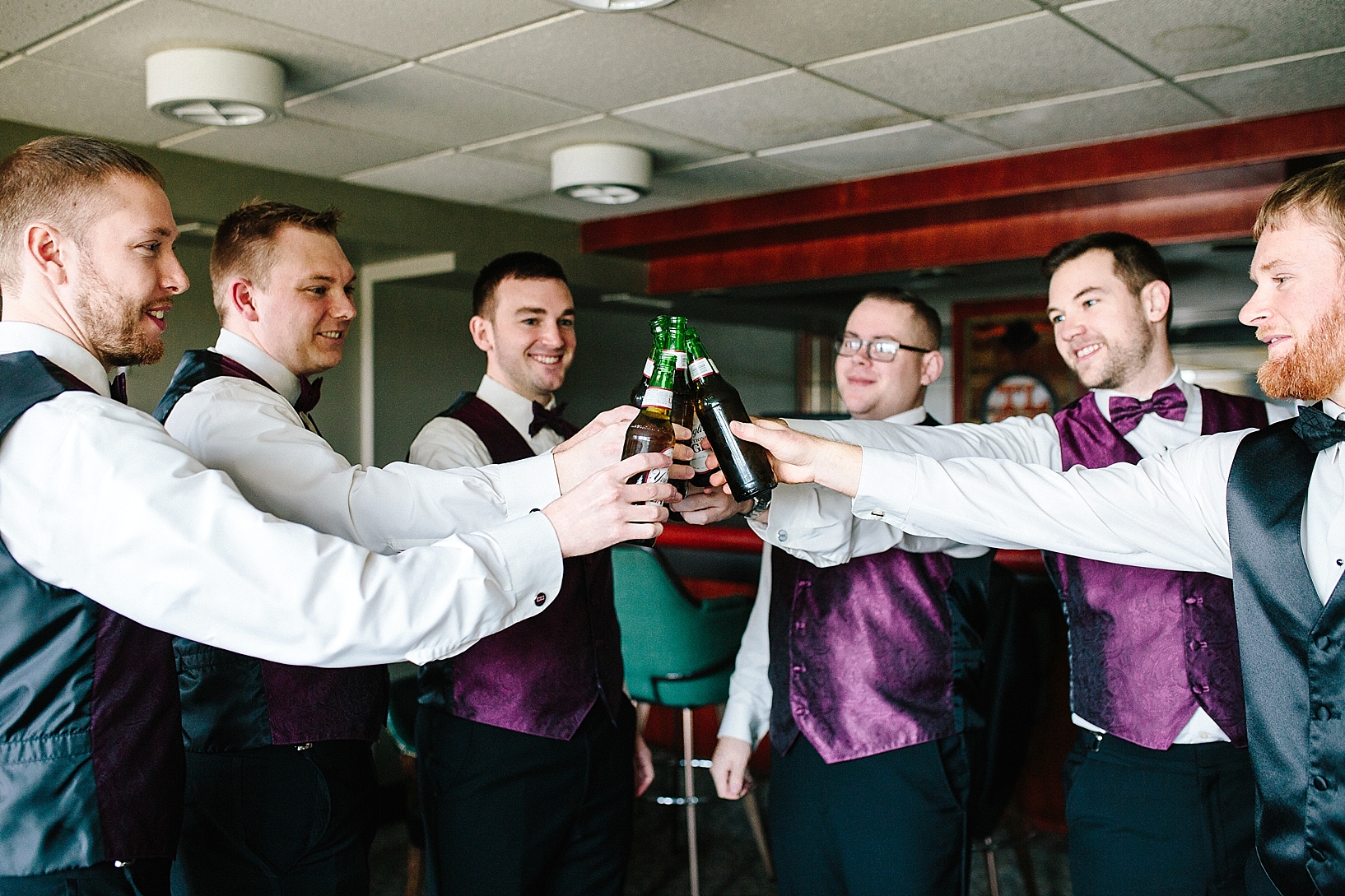 groom and groomsmen drinking beer