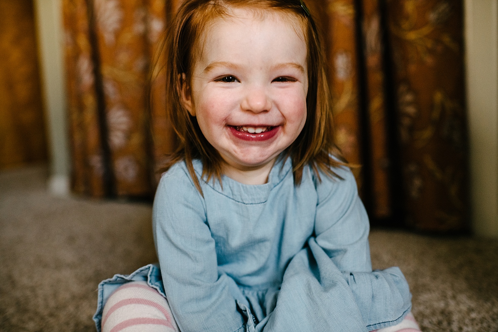 toddler girl with red hair smiling 2 Years old