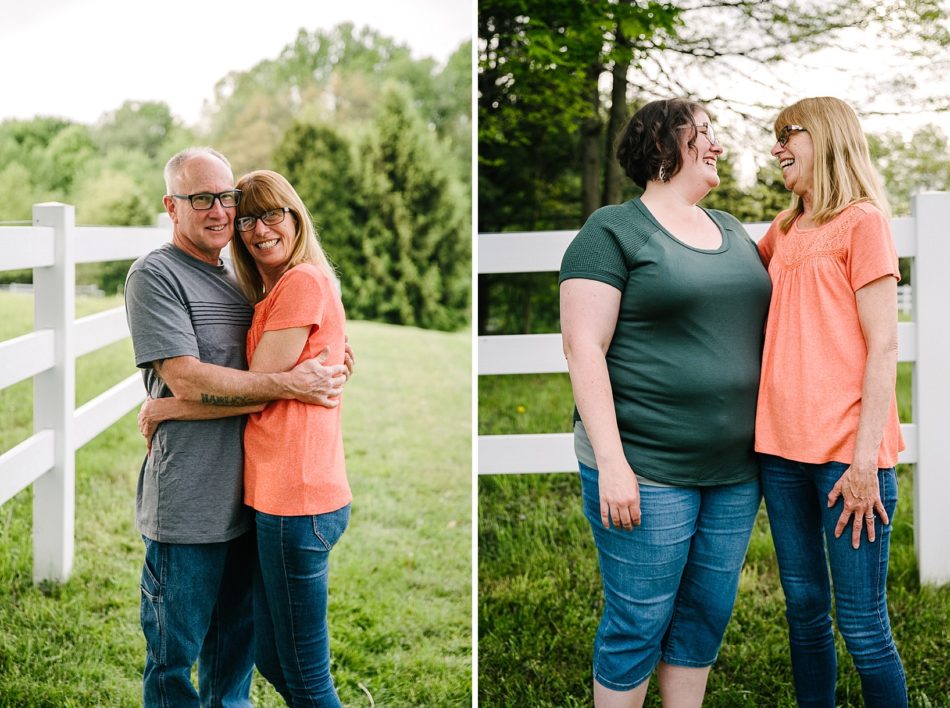 A couple hugs and smiles by white picket fence backyard generational family session