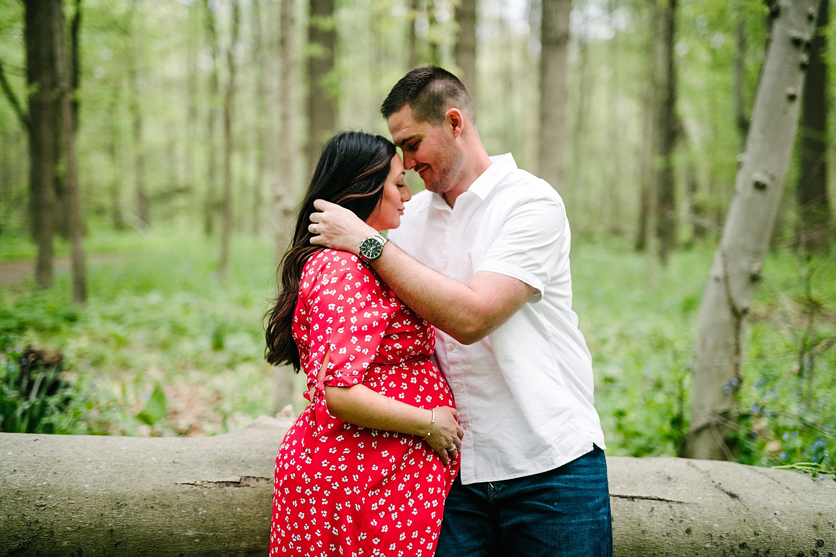 A couple in woods maternity photography shoot