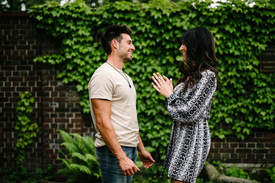 Woman smiles at fiance after surprise proposal