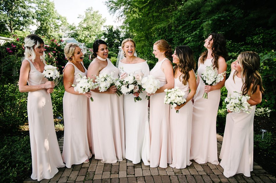 Bridal party poses and laughs during Fellows Riverside Gardens wedding