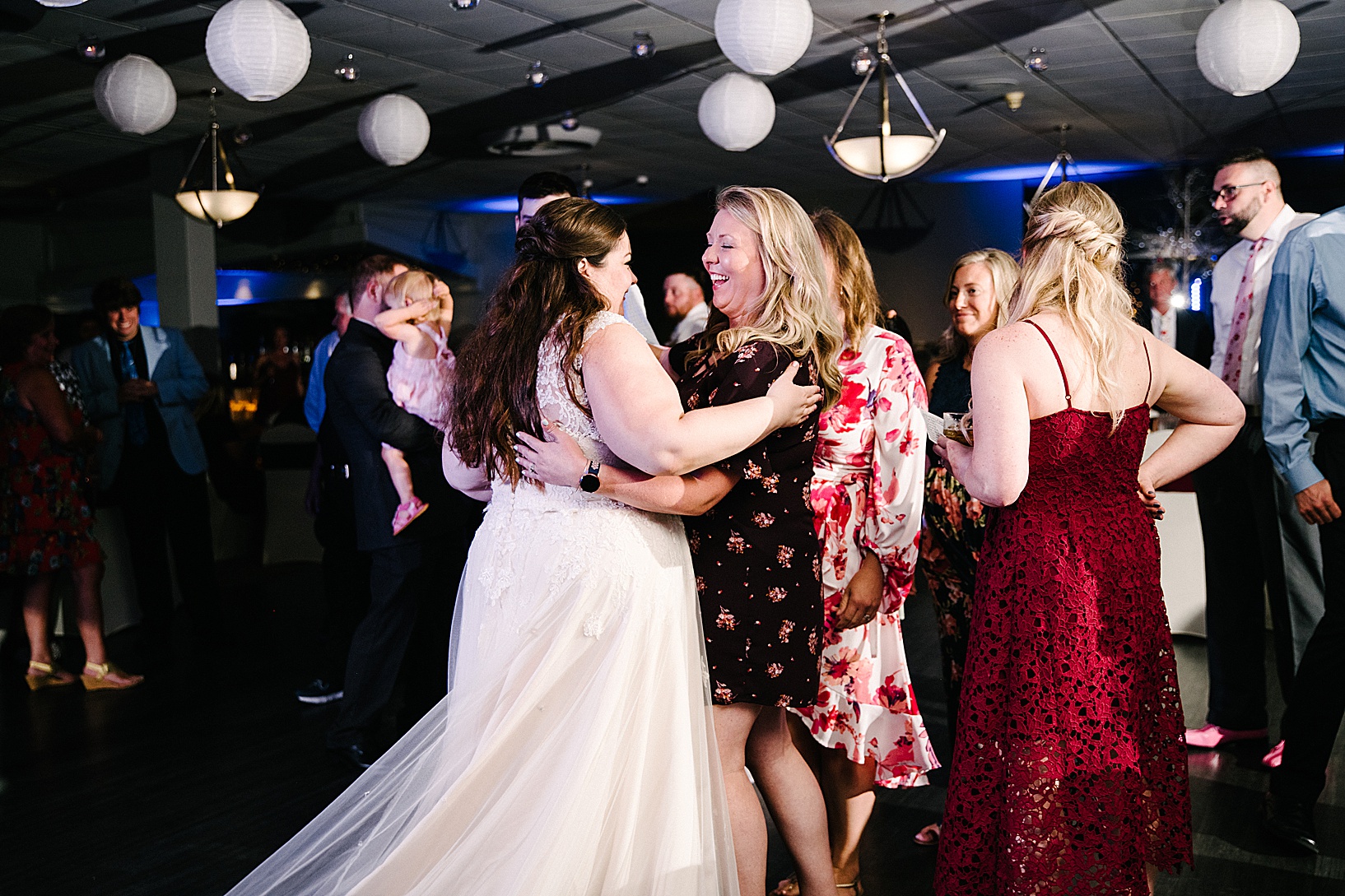 The bride dances with a woman on the dance floor of DiLucia's Banquet Hall during post wedding celebration