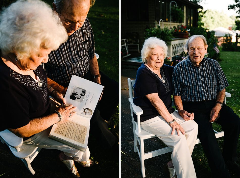 Grandmother and grandfather look through a book of their memories.