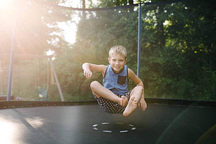 Little boy jumping on trampoline