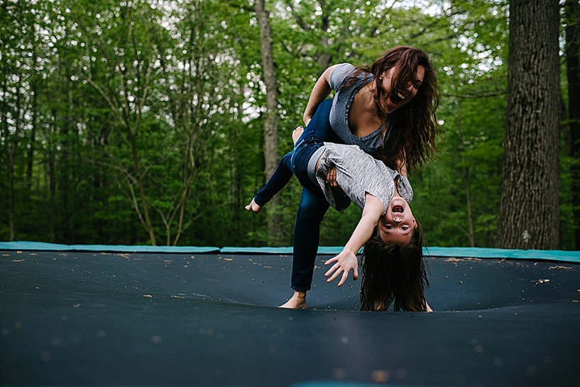 mom and daughter on trampoline
