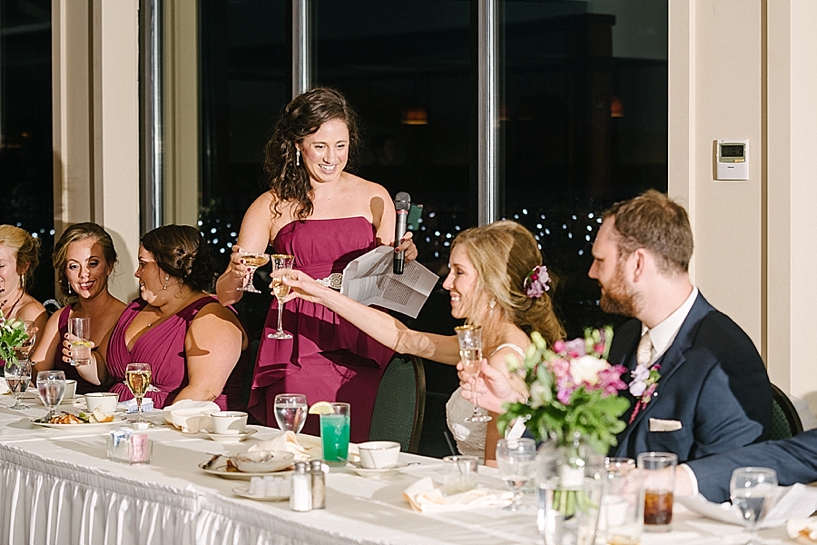 maid of honor toasting the bride and groom