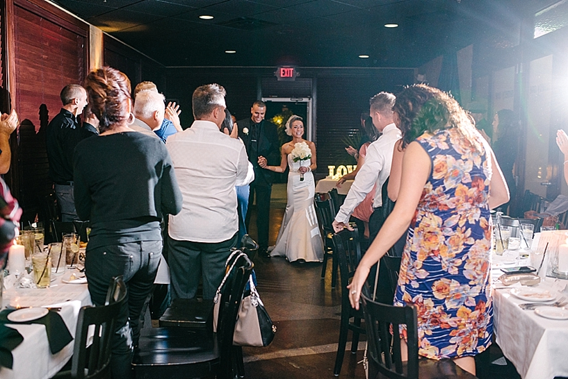 bride and groom entering dinner reception at 91 Wood Fired Oven Canton OH