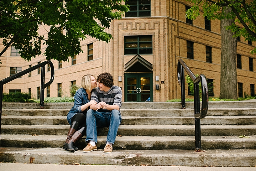 couple sitting on the steps of college dorm on Kent State university campus