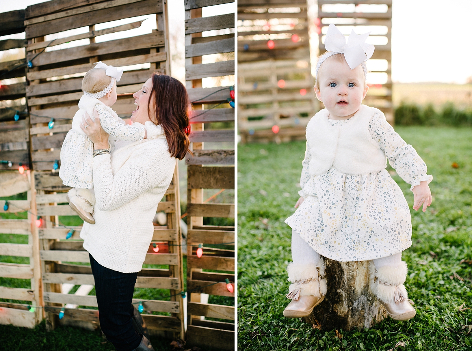 mother in cream sweater holding daughter in front of pallet wall