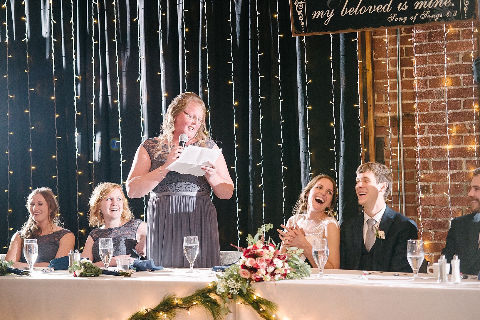 maid of honor giving toast at wedding reception
