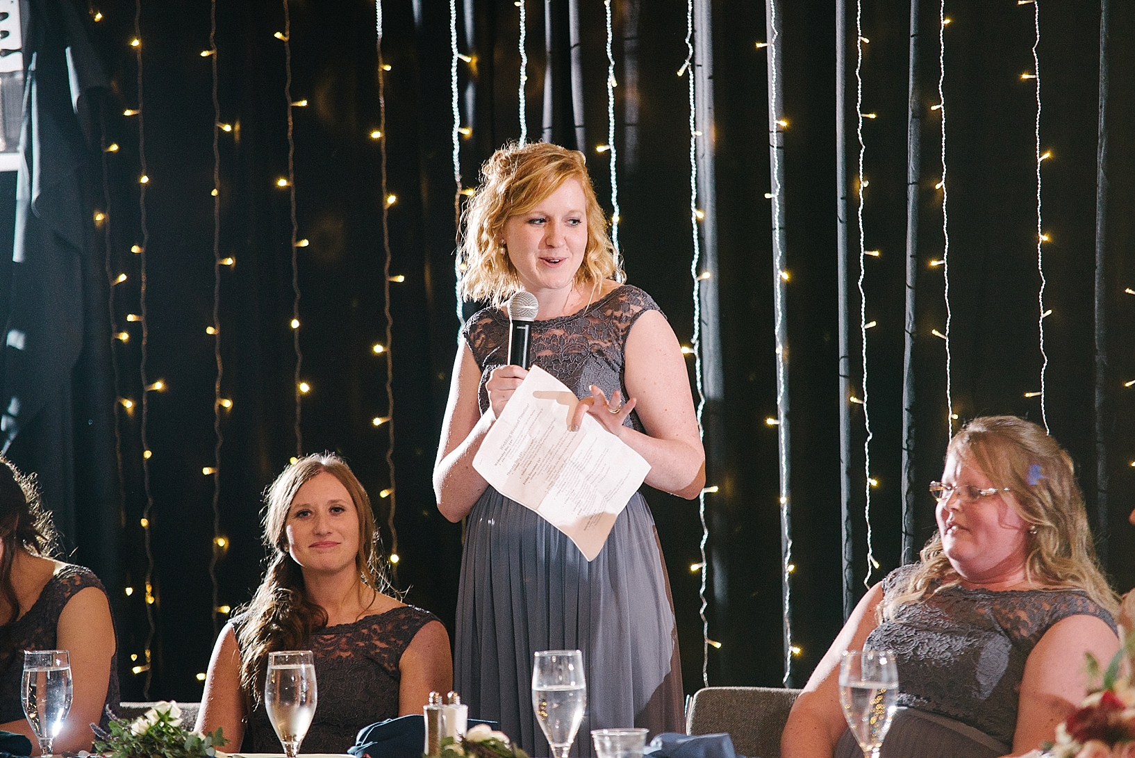 matron of honor giving toast at wedding reception