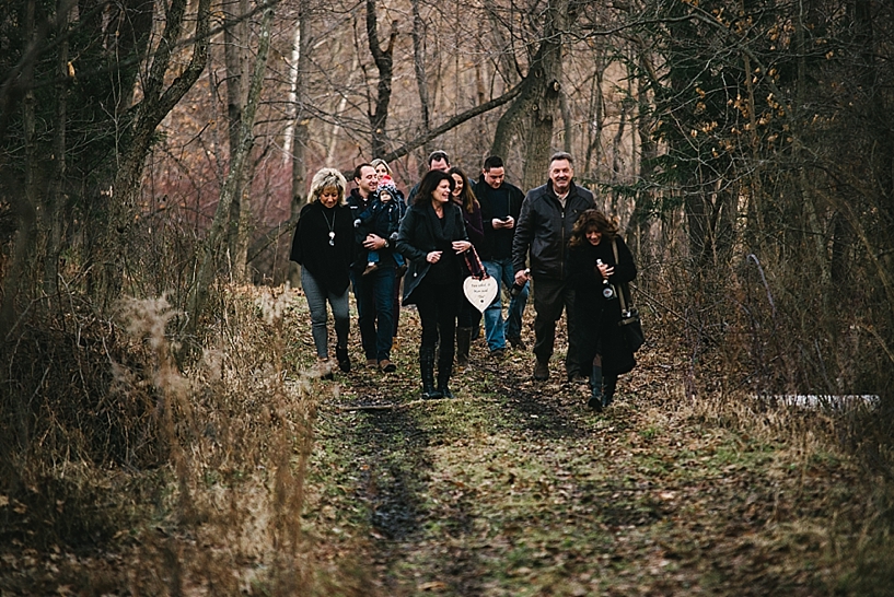 group of family walking through woods 