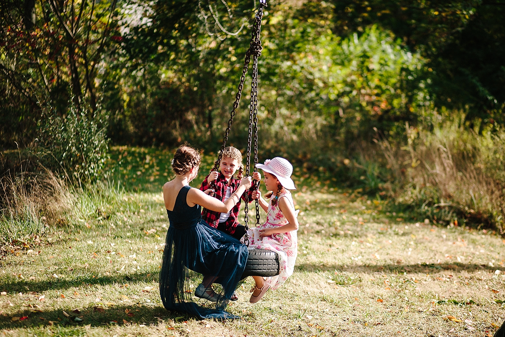 little girls swinging on tire swing by pond at Stone Ledge farm Twinsburh OH