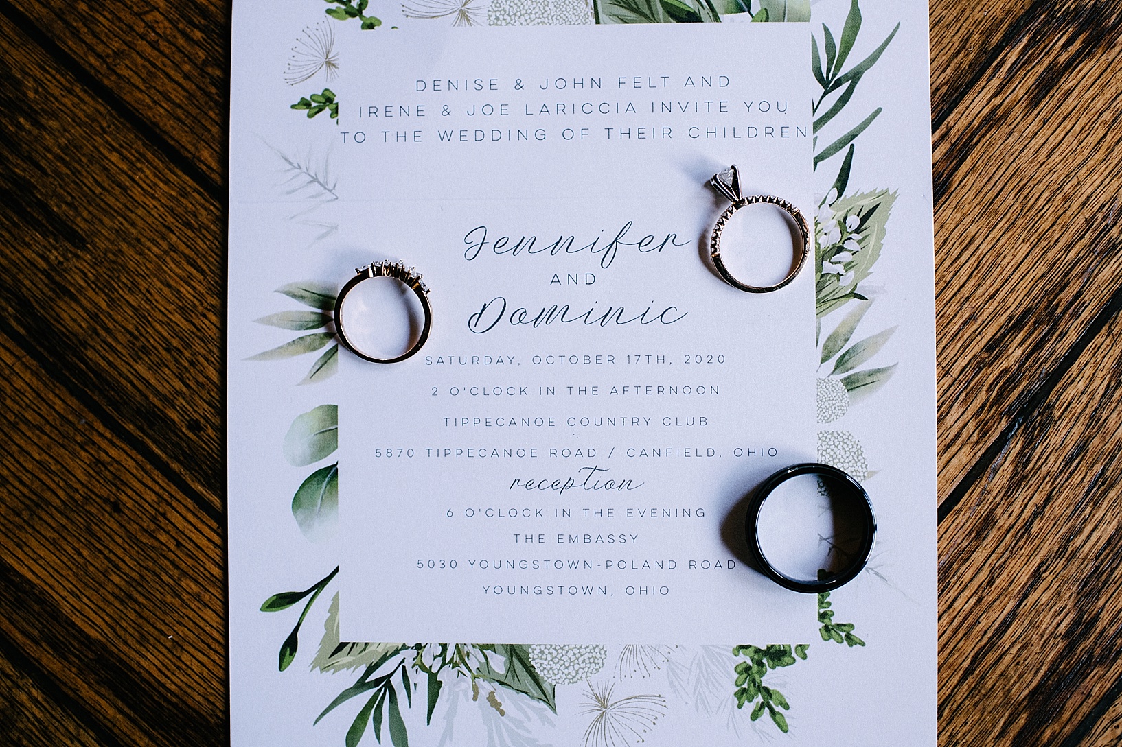 wedding invitation with wedding bands on it