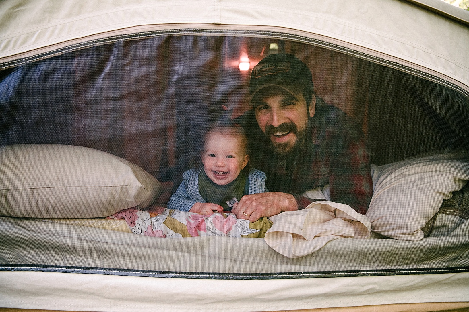 dad and toddler in pop up camper