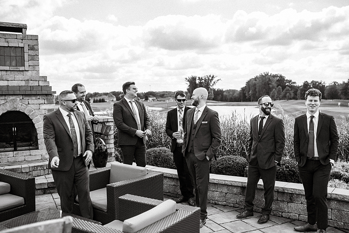 groom and groomsmen outside on patio of Courtyard Marriott in Canfield